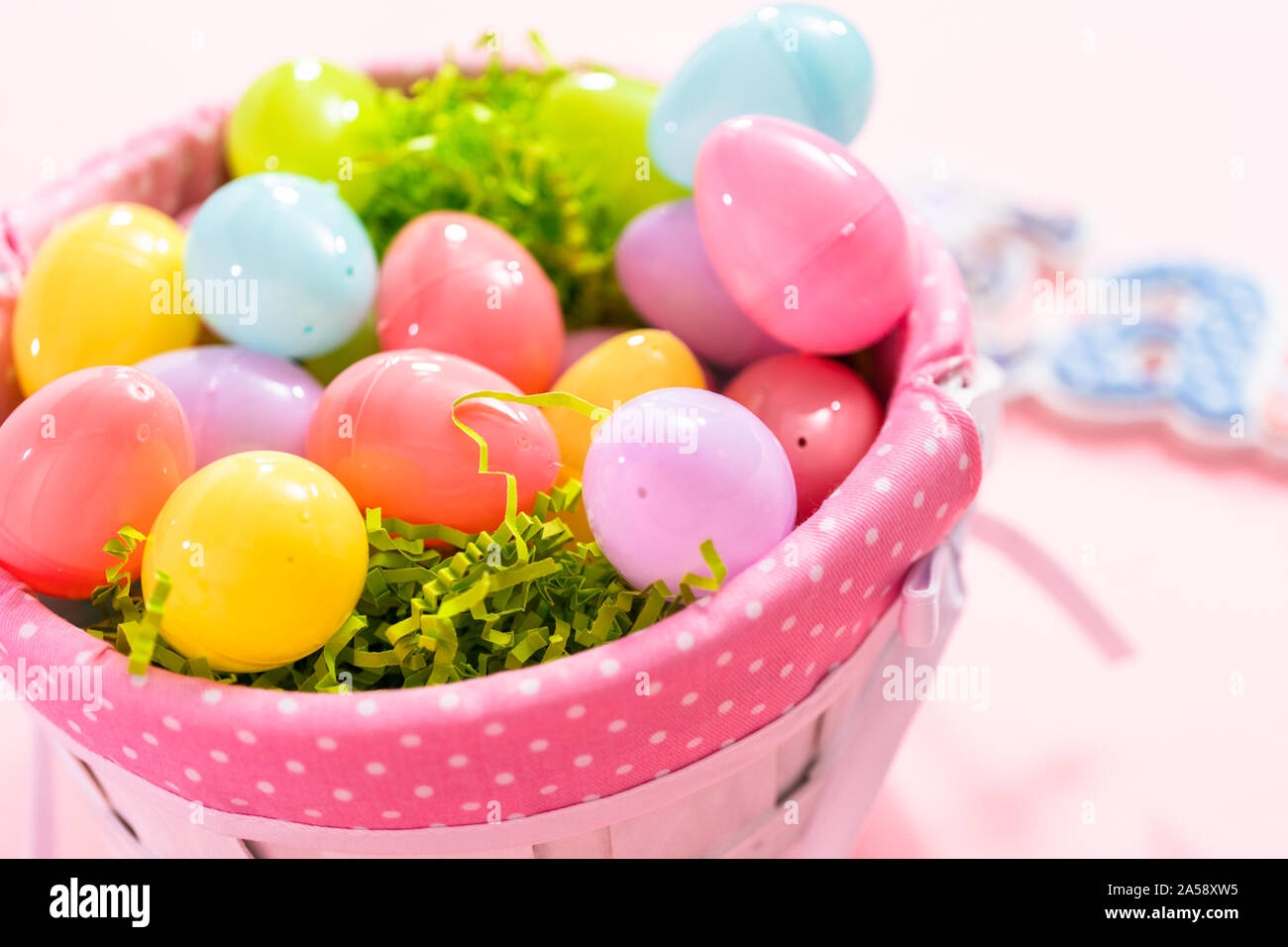 Easter Basket With Easter Eggs On A Pink Background Stock Photo Alamy